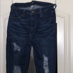 Ripped dark blue jeans